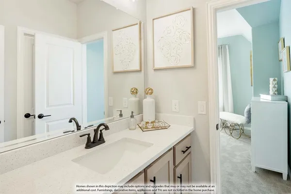 a bathroom with a double vanity sink mirror and