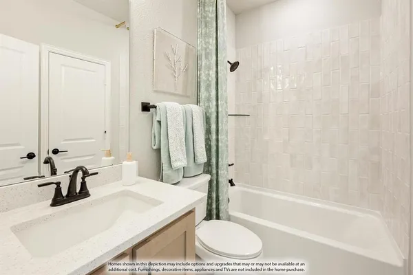 a bathroom with a sink toilet a shower and bathtub