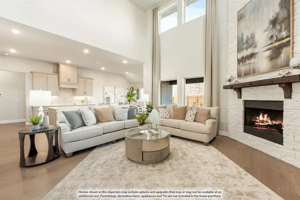 a living room with furniture a fireplace and a large mirror