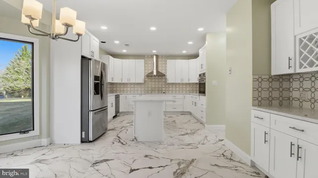 a kitchen with a sink cabinets and window