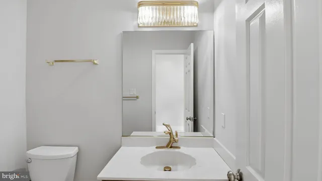 a view of a hallway with entryway wooden floor and front door