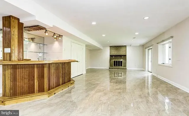 a view of a livingroom with a kitchen