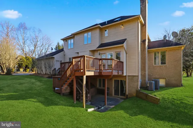 a view of balcony with wooden floor and fence