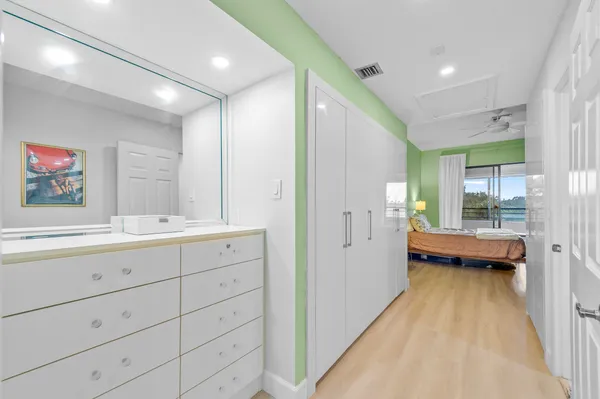 a bathroom with a sink and a large mirror