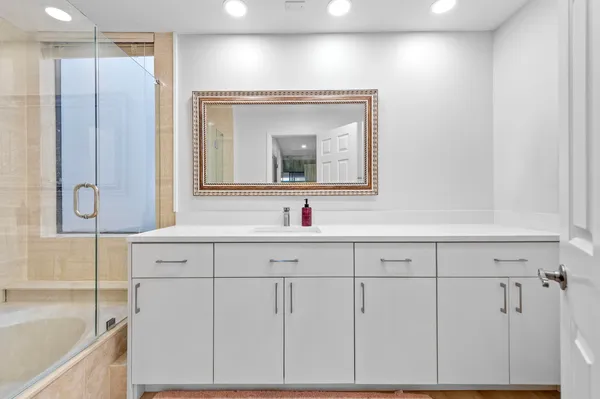 a bathroom with a sink and a mirror