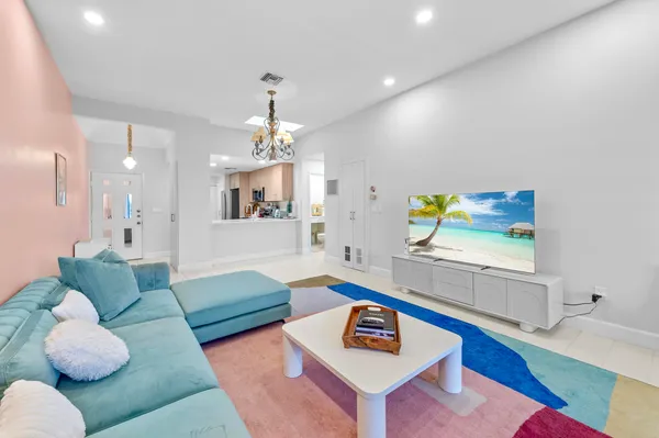 a living room with furniture and a rug