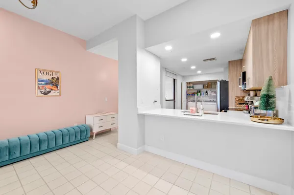 a bedroom with a bed and a large mirror