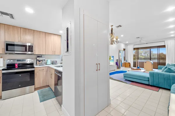 a kitchen with granite countertop lots of counter top space and stainless steel appliances