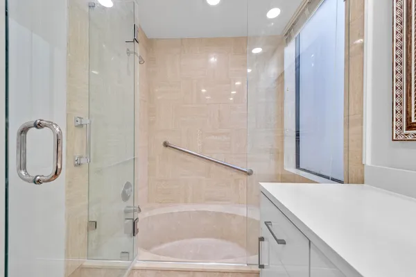 a bathroom with a bathtub and a shower