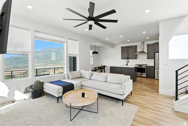 6039 North Westridge Road Heber City, UT 84032 - Photo 2 of 22 Open-concept living space featuring high ceilings, recessed lighting, and a modern ceiling fan