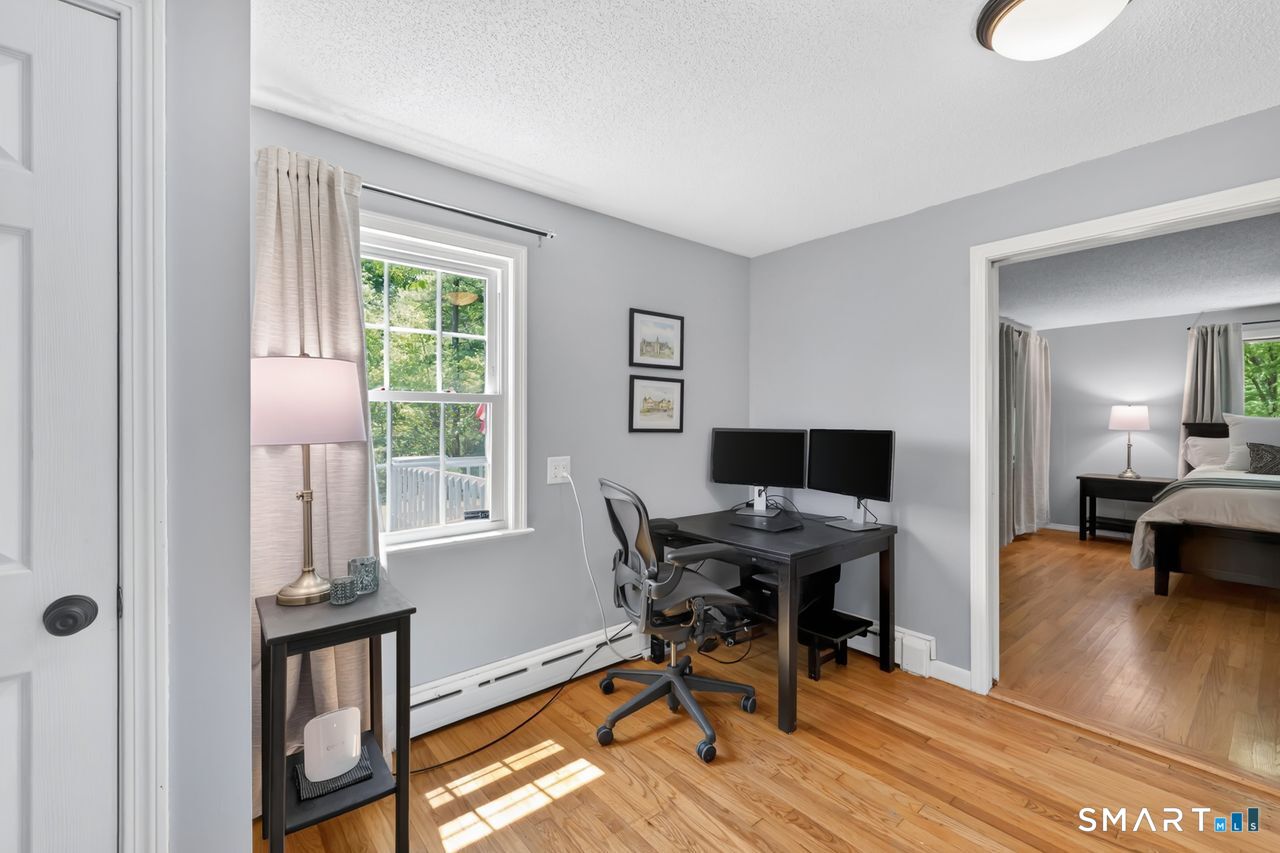 1013 Ratley Road Suffield, CT 06093 - Photo 25 of 39 a workspace with wooden floor and a window
