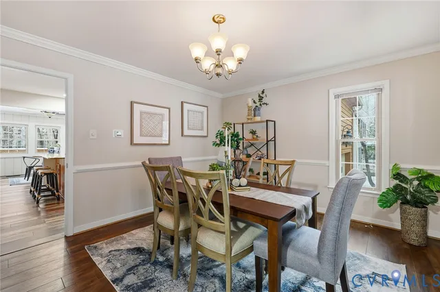 a view of a livingroom with furniture window and wooden floor