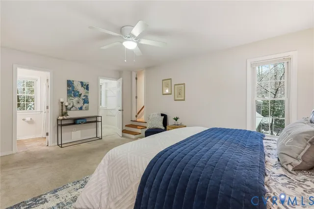a view of a swimming pool with a yard and sitting area