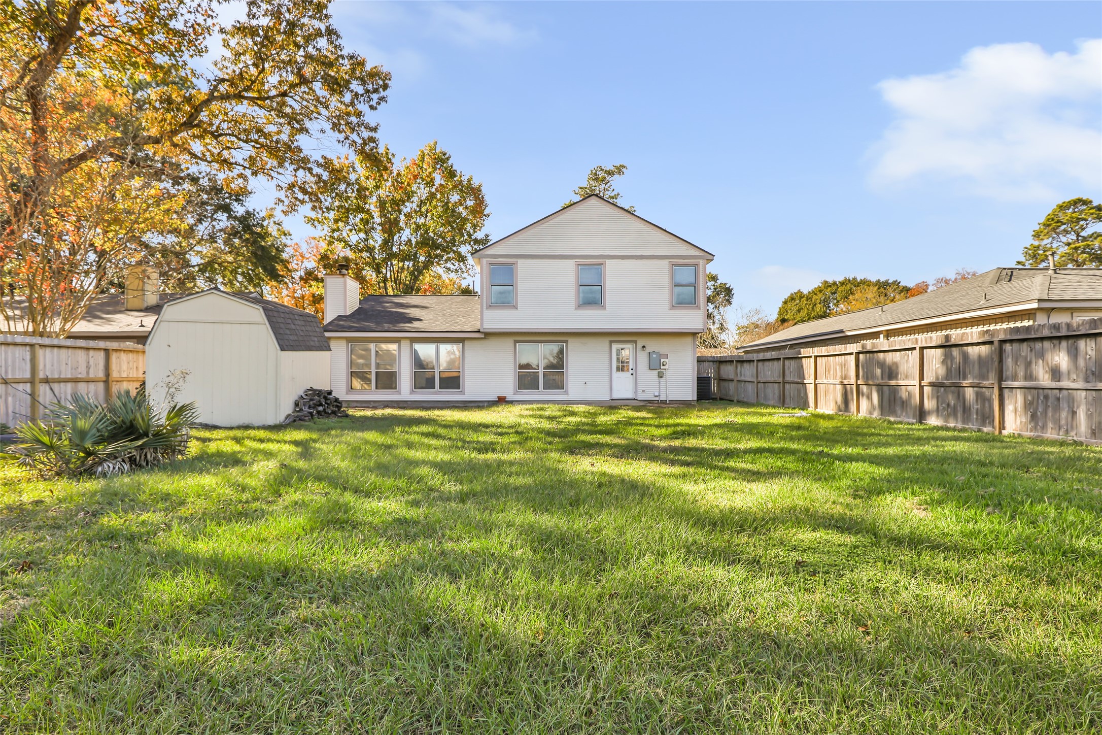 18910 Yaupon Trail Humble, TX 77346 - Photo 21 of 22 Large backyard with storage shed