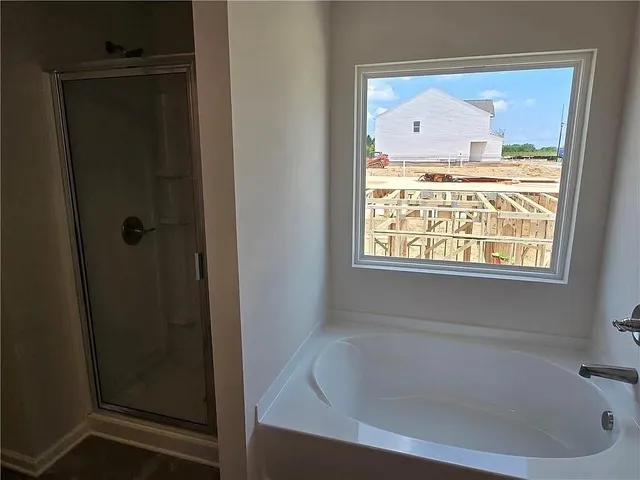 a bathroom with a double vanity sink and mirror