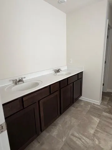 a view of an empty room with stairs