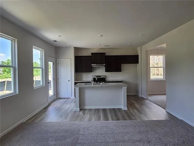 a view of a kitchen with a sink and dishwasher