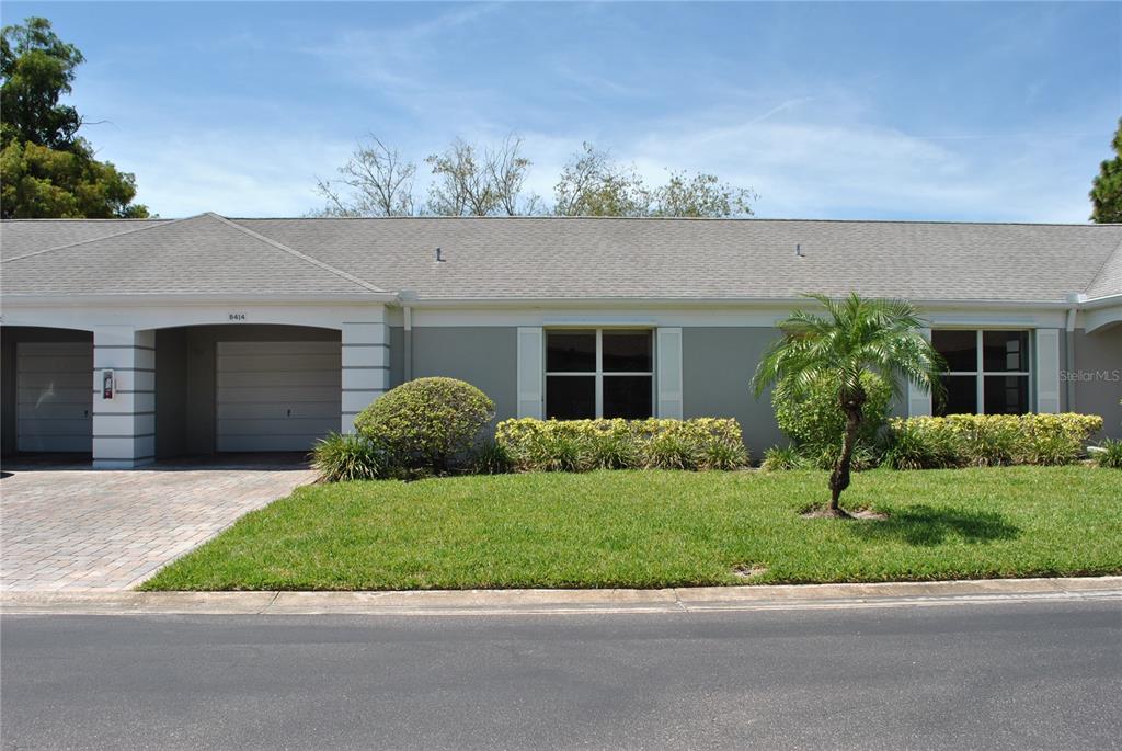 8414 Annwood Road, Unit 8414 Seminole, FL 33777 - Photo 1 of 28 a front view of a house with a yard and garage