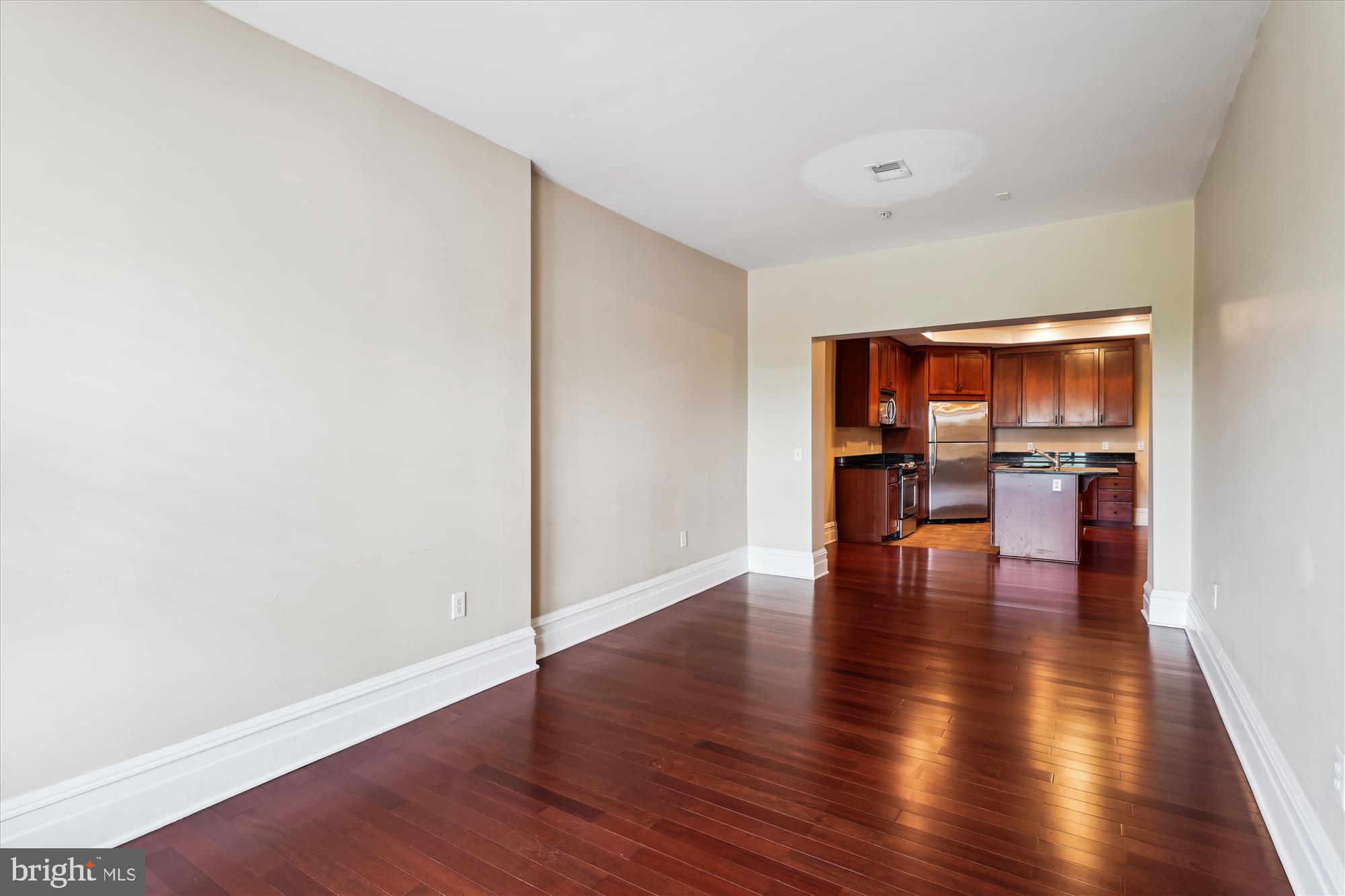 9610 Dewitt Drive, Unit PH410 Silver Spring, MD 20910 - Photo 15 of 64 a view of empty room with wooden floor and a window