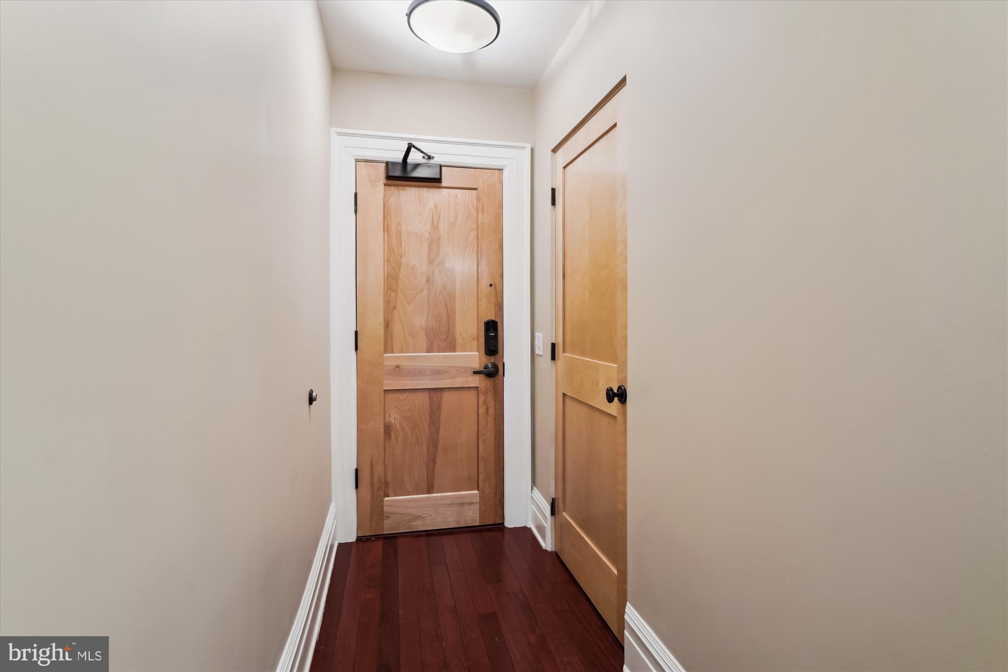 9610 Dewitt Drive, Unit PH410 Silver Spring, MD 20910 - Photo 2 of 64 a view of a hallway with wooden floor