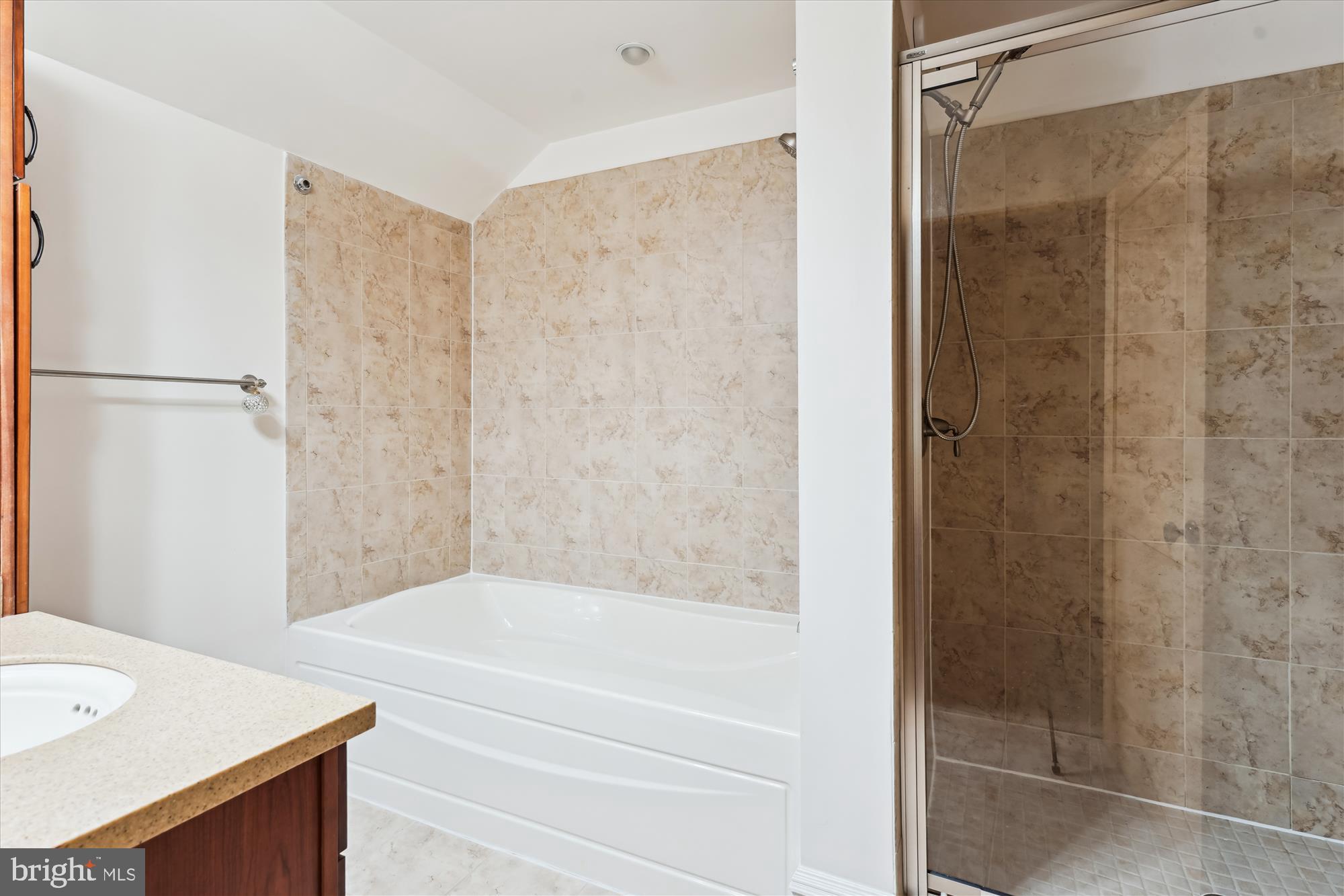 9610 Dewitt Drive, Unit PH410 Silver Spring, MD 20910 - Photo 21 of 64 a bathroom with a bathtub and a shower