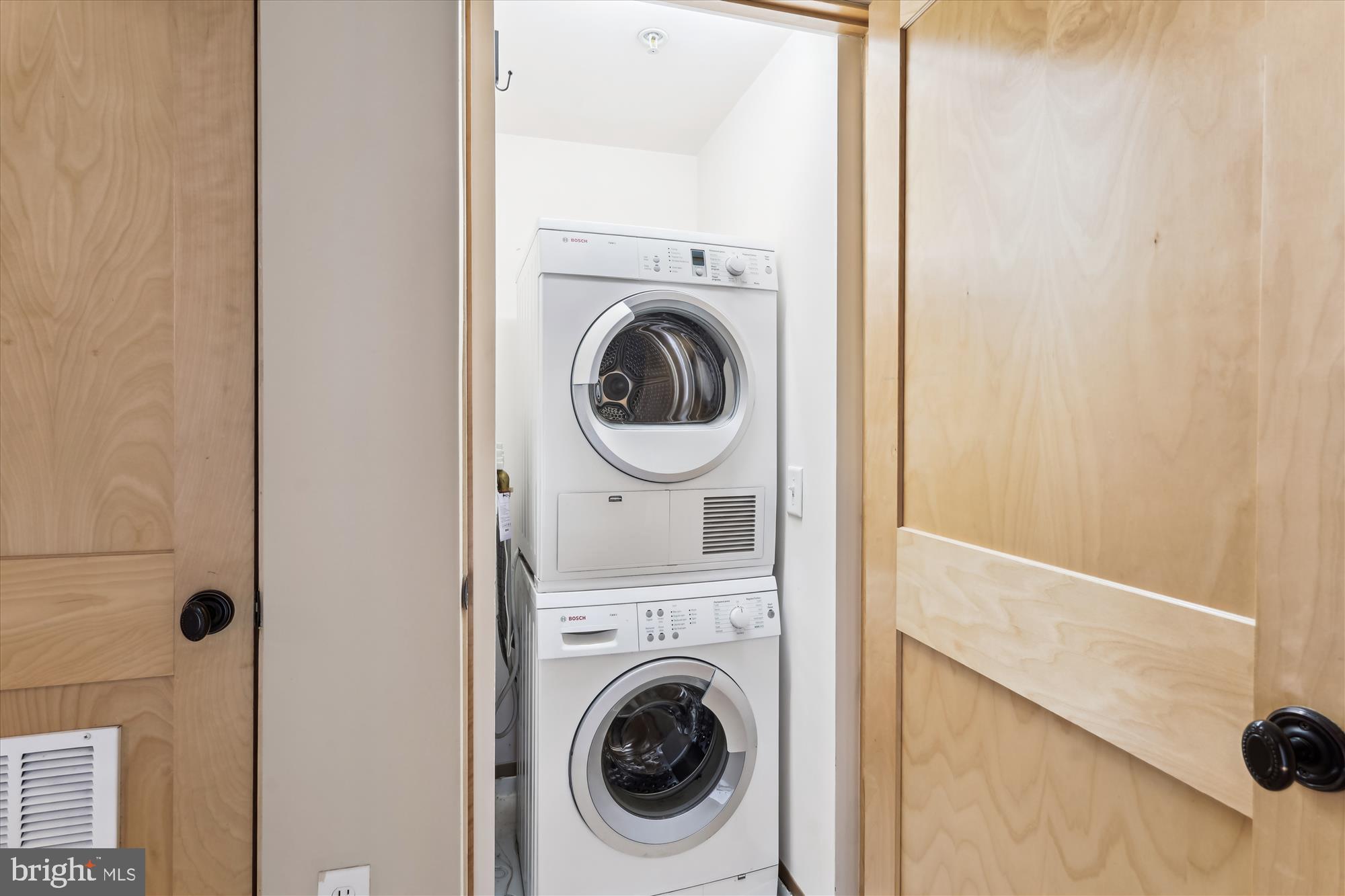 9610 Dewitt Drive, Unit PH410 Silver Spring, MD 20910 - Photo 31 of 64 a utility room with dryer and washer