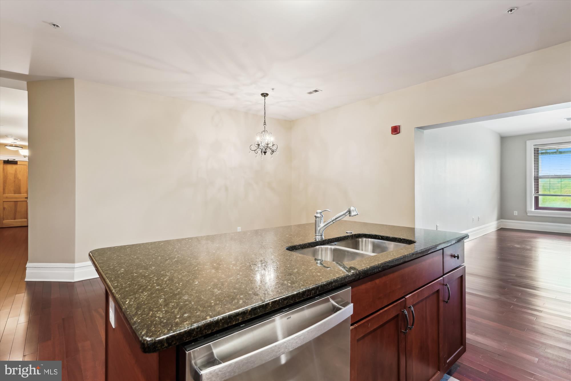 9610 Dewitt Drive, Unit PH410 Silver Spring, MD 20910 - Photo 10 of 64 a kitchen with granite countertop a sink and cabinets