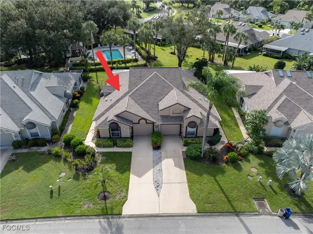 an aerial view of house with yard