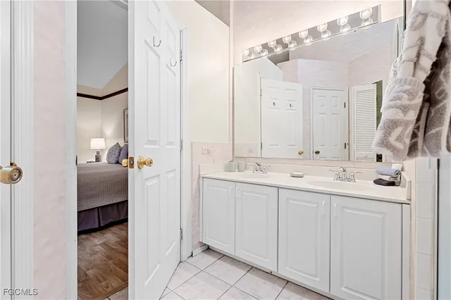 a bathroom with a double vanity sink and mirror