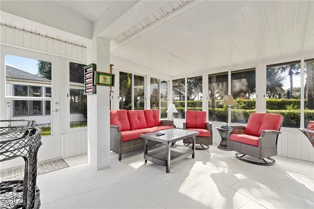 a outdoor living space with furniture and a floor to ceiling window