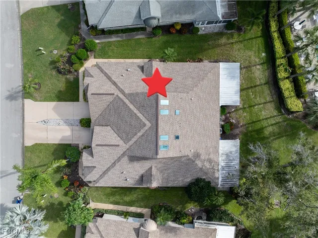 an aerial view of residential house with outdoor space