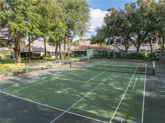 a view of a tennis court with a basket ball court