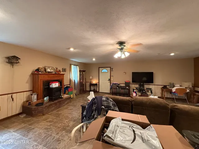 a living room with furniture and a fireplace