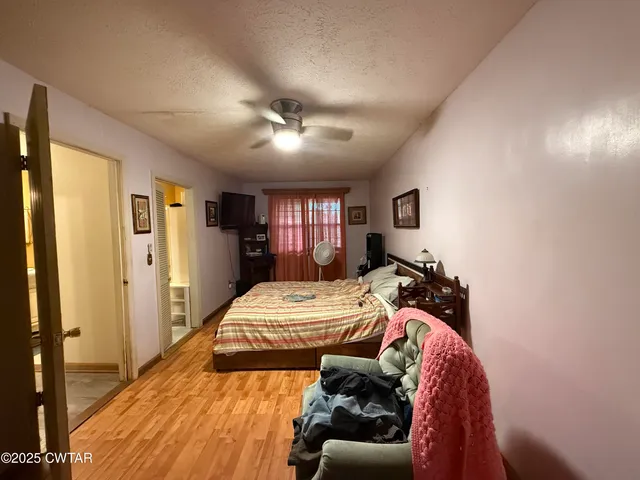 a bed room with a bed and a chandelier