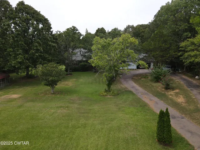 a view of a water pond with green space