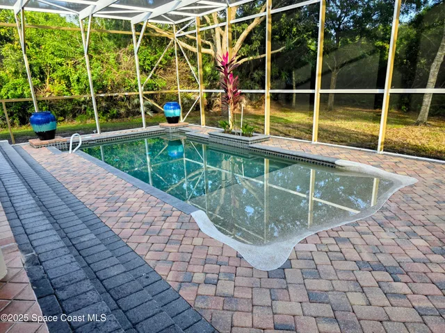 a view of swimming pool from a balcony
