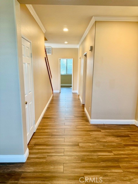 23636 Aquacate Road Corona, CA 92883 - Photo 14 of 74 a view of a hallway with wooden floor and staircase