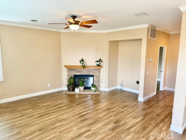 23636 Aquacate Road Corona, CA 92883 - Photo 26 of 74 a view of an empty room with wooden floor and a fireplace