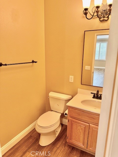 23636 Aquacate Road Corona, CA 92883 - Photo 33 of 74 a bathroom with a sink a toilet and a mirror
