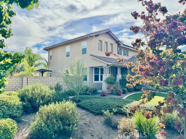 23636 Aquacate Road Corona, CA 92883 - Photo 4 of 74 a view of a house with a yard and garden