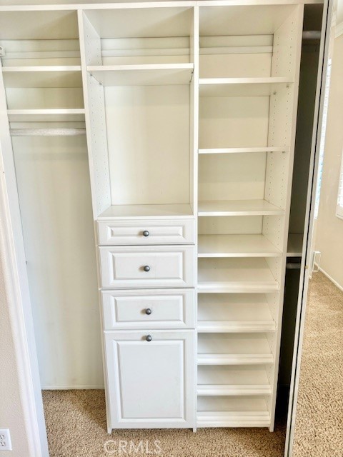 23636 Aquacate Road Corona, CA 92883 - Photo 43 of 74 a view of walk in closet with empty racks