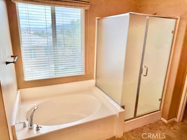 23636 Aquacate Road Corona, CA 92883 - Photo 50 of 74 a bathroom with a bathtub and a shower