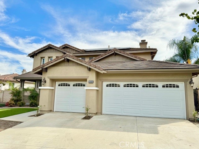 23636 Aquacate Road Corona, CA 92883 - Photo 5 of 74 a view of a house with a garage and a roof