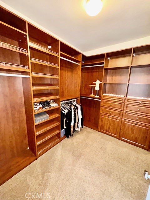 23636 Aquacate Road Corona, CA 92883 - Photo 52 of 74 a view of walk in closet with empty racks