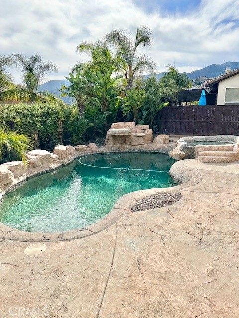 23636 Aquacate Road Corona, CA 92883 - Photo 59 of 74 a view of a backyard with plants and lake view