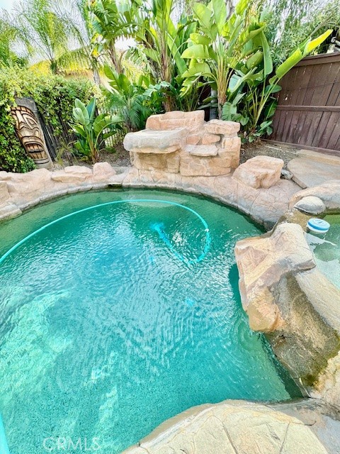 23636 Aquacate Road Corona, CA 92883 - Photo 61 of 74 a view of a backyard with table and chairs potted plants