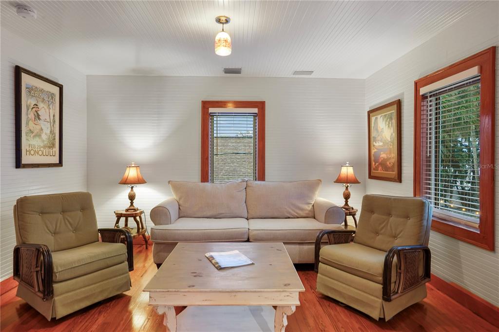 702 Pass A Grille Way St. Pete Beach, FL 33706 - Photo 27 of 41 a living room with furniture and a large window
