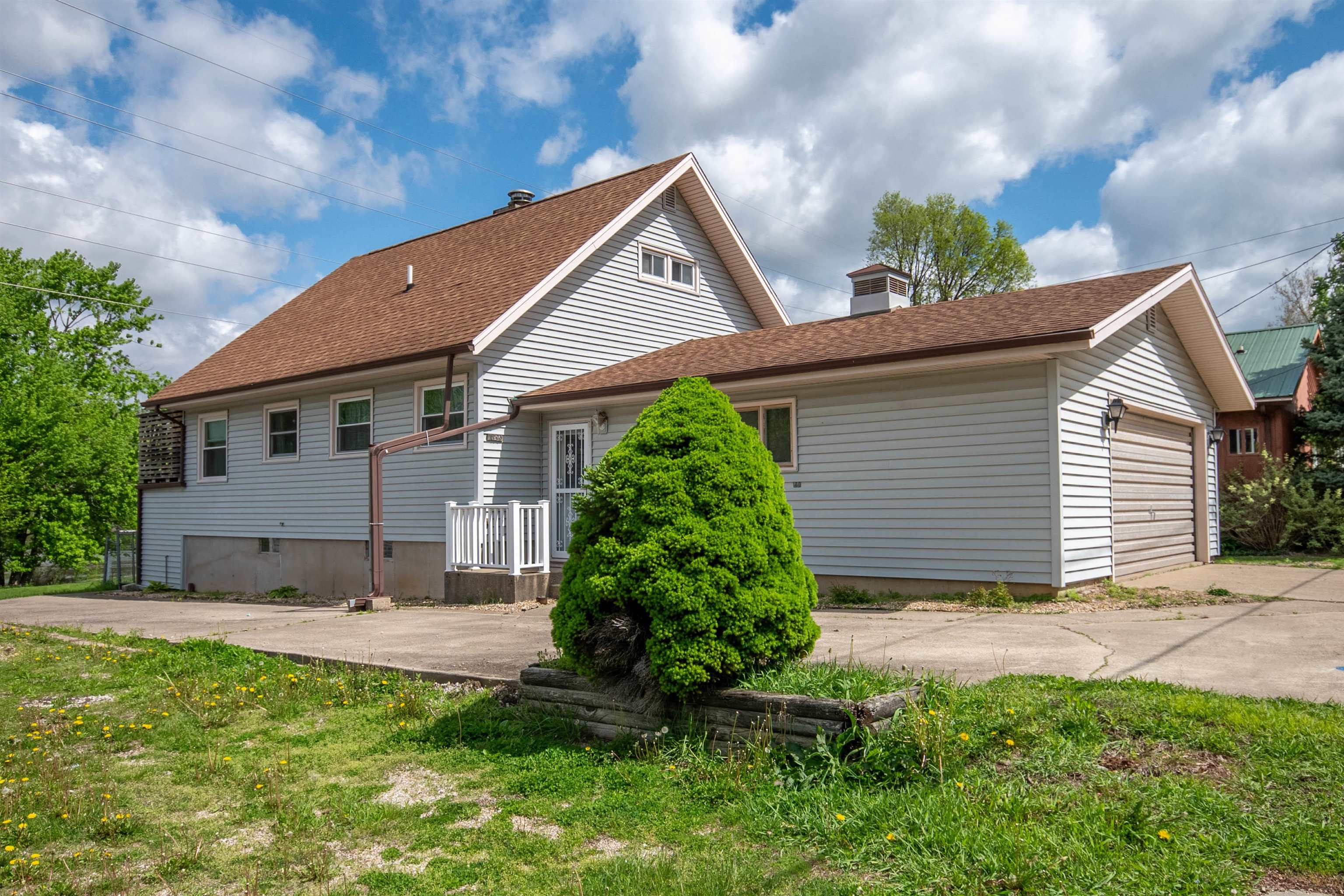 1839 West 1st Street Dixon, IL 61021 - Photo 1 of 44 a view of a house with a yard and plants