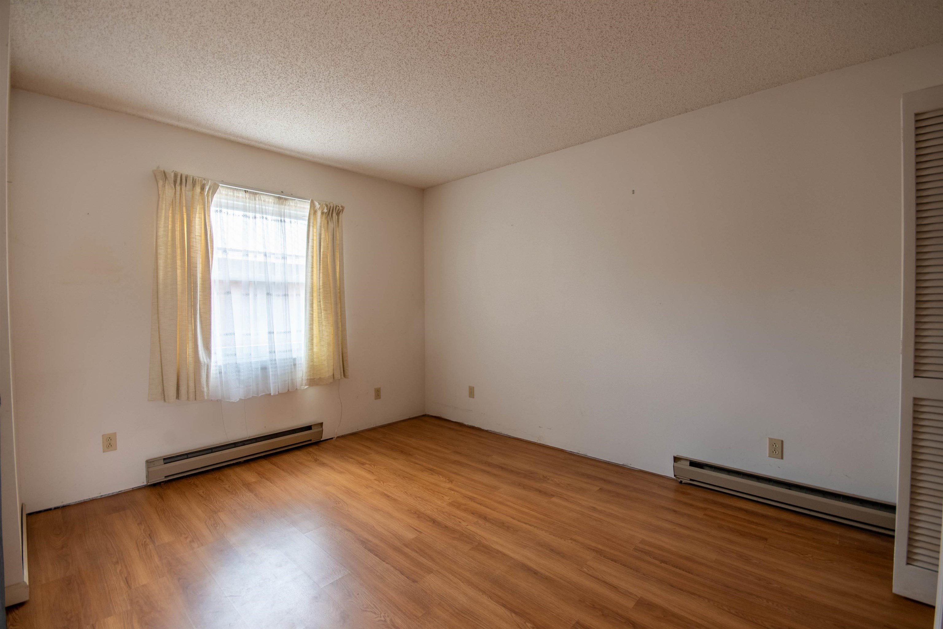 1839 West 1st Street Dixon, IL 61021 - Photo 16 of 44 an empty room with wooden floor and windows