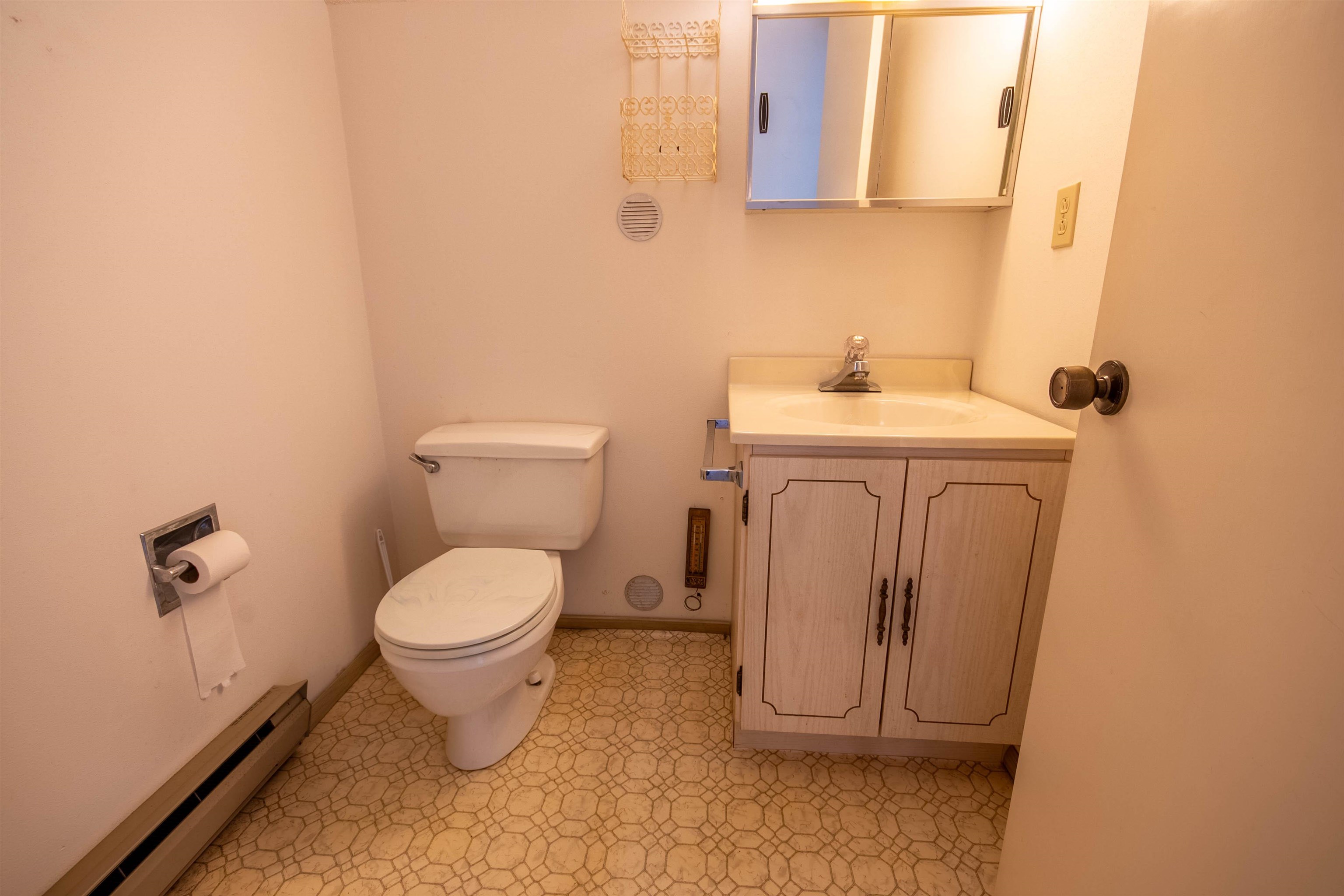 1839 West 1st Street Dixon, IL 61021 - Photo 24 of 44 a white toilet sitting next to a bathroom sink
